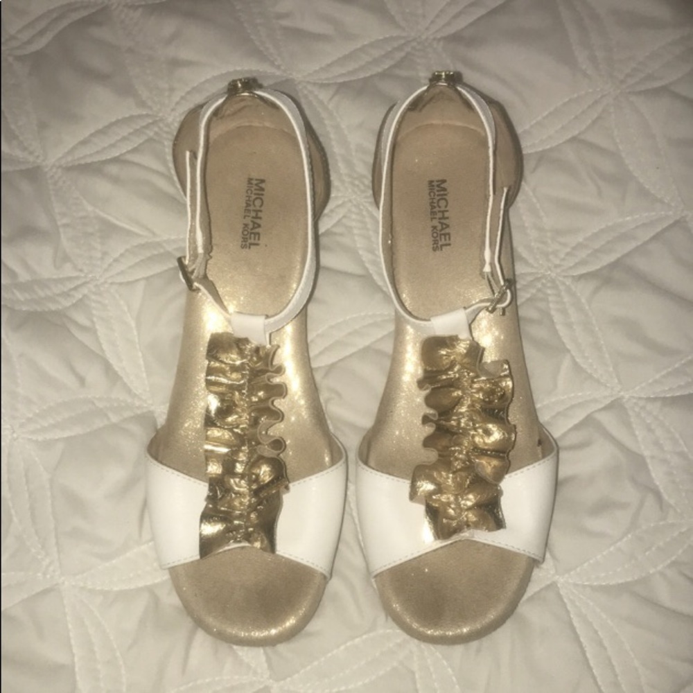 MK gold and white wedged heels with gold ruffle